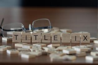 Scrabble tiles spelling Title IX