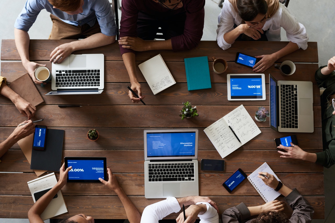 Top view of people working on laptops