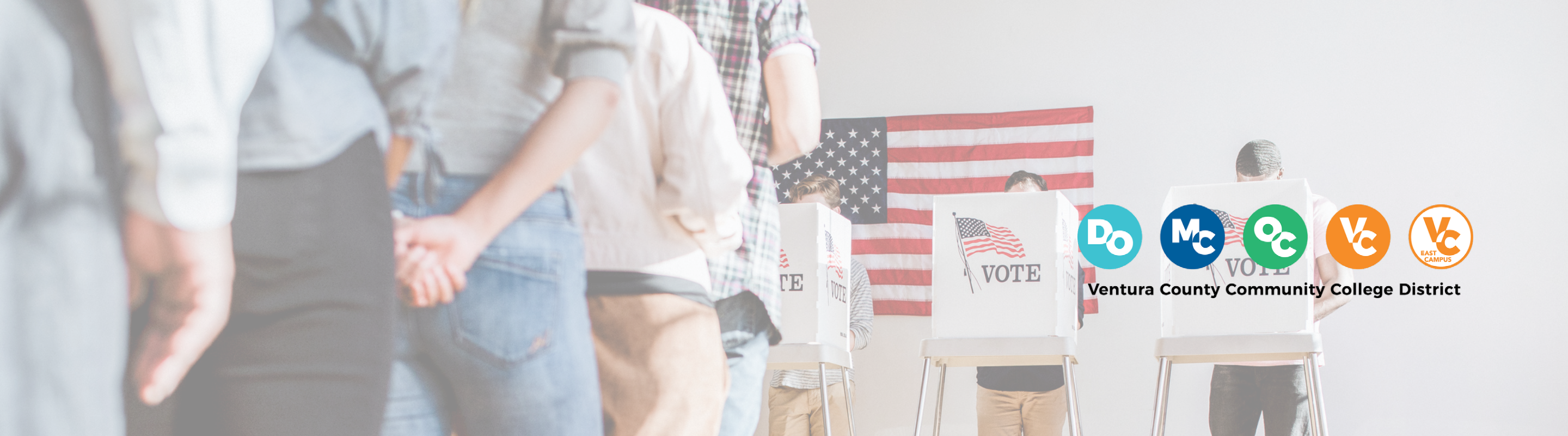 People lining up to vote, four voting booths are in front of an American flag