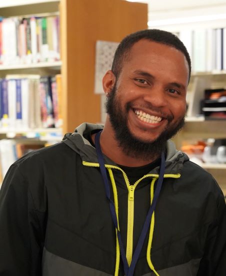 Smiling male student at Oxnard College's library