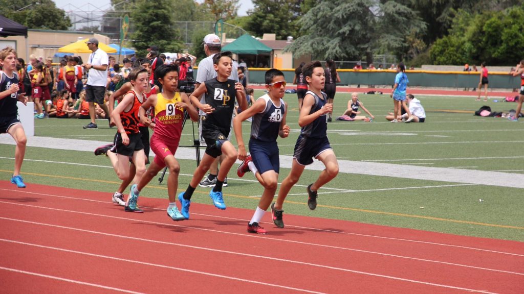 Nubia's son Cruise, runner wearing the red glasses.