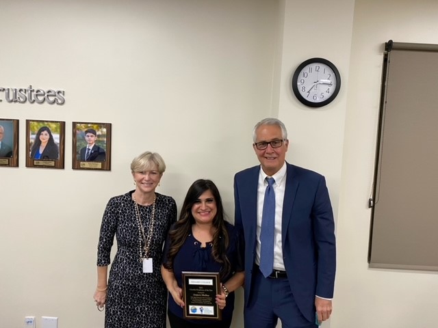 Board Chair McKay and Dr. Gillespie presenting Amparo Medina with the Classified Employee of the Year Award for Oxnard College
