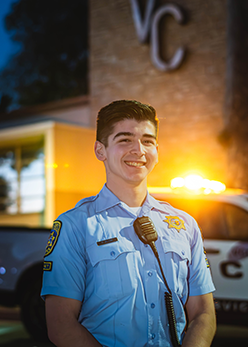 Photo of Cadet Alton in front of the VC Administration Building
