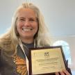 Jana Johnson with ZAA award for saving the endangered Palos Verdes blue butterfly