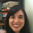 Picture of Prof. Scrofano standing in front of a bookshelf