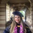 Dr. Schmidt standing in regalia at UCLA