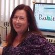 Portrait of Robin Douglas sitting at her desk