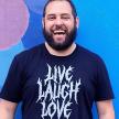 Nick Norton wearing a black Live Laugh Love T shirt in death metal font