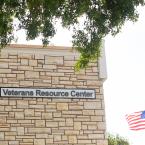 Sign on the side of a building that reads &quot;Veterans Res
