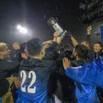 Soccer team celebrates their win