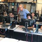 Moorpark College students in a classroom with computers.