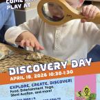 Discovery Day toddler with magnifying glass looking at shell
