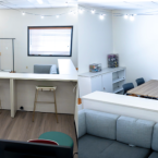 Inside the Campus Pride Center, computer stations, counter w