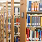 Rows of bookshelves in a library.