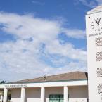 Side view of the clock tower on the Oxnard College campus.