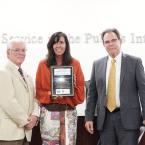 Classified Employee of the Year Deb Brackley with Board Chair Bernardo Perez and Chancellor Rick McLennan