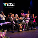 State of the District logo overlaid on a photo of community college leaders and audience members applauding on stage at a Ventura County event.