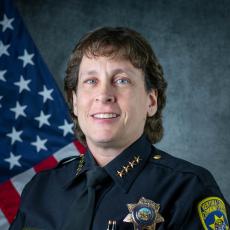 Headshot portrait of VCCCD Chief of Police Kelli Florman in police uniform