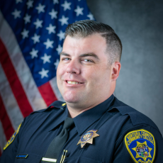 Official department photo of Officer Anthony Rodriguez in his Class A uniform.