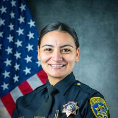 Official department photo of Officer Erika Olvera in her Class A uniform.