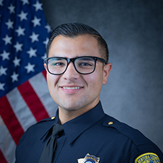 Official department photo of Officer Raul Mejia in his Class A uniform.