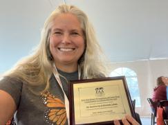Jana Johnson with ZAA award for saving the endangered Palos Verdes blue butterfly