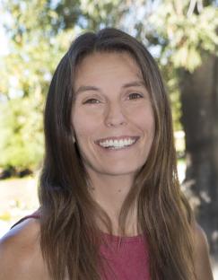 Tracie Bosket standing in front of a tree - profile picture