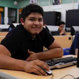 male student in a computer networking class at oxnard college