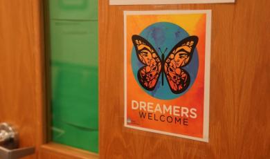 Sign on a door with a butterfly and the text &quot;Dreamers 