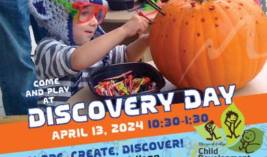 Discovery Day Young child decorating a pumpkin Discovery Day Young child decorating a pumpkin