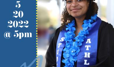 female graduate in cap and gown wearing blue Hawaiian flower