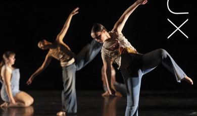 2 dancers on a black background