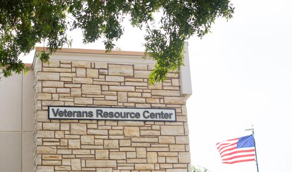 Sign on the side of a building that reads &quot;Veterans Res