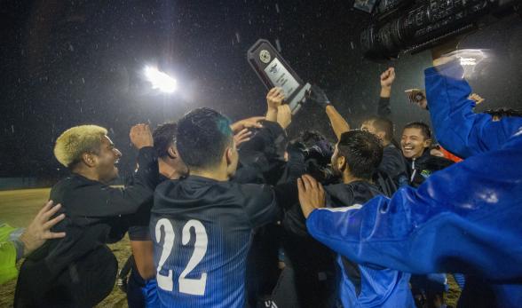 Soccer team celebrates their win
