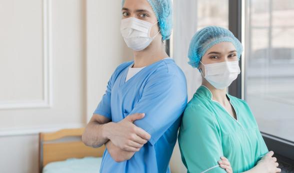 Nurses wearing scrubs and masks