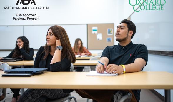 Photo of students sitting in class listening to a lecture an