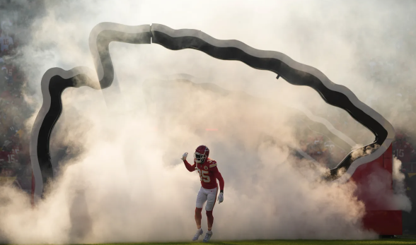 Kansas City Chiefs player wearing number 35 runs onto the fi