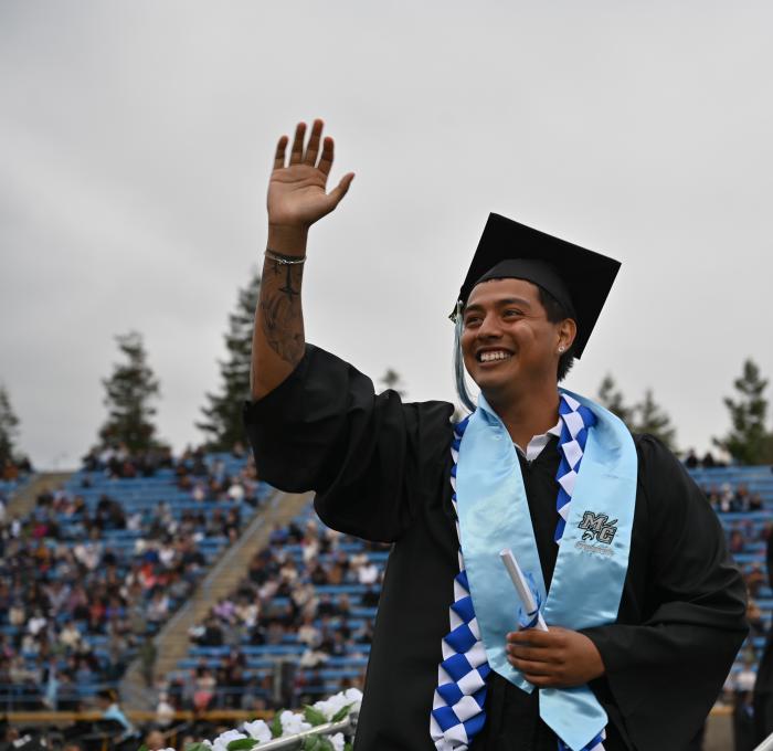 Moorpark College Graduate waving 