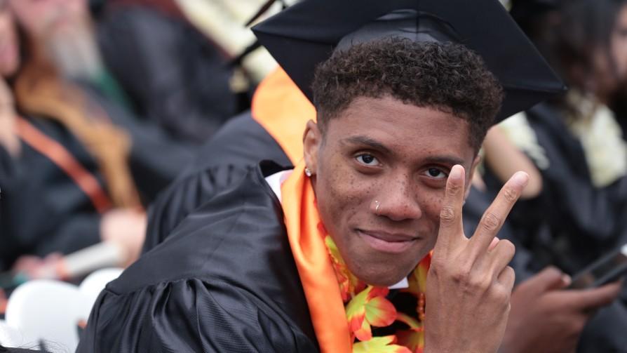 ventura college graduate giving peace sign