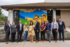 Oxnard College leaders and artists standing in front of new 