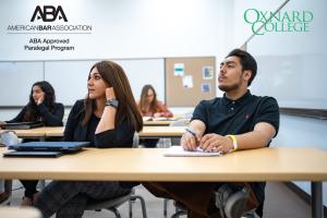 Photo of students sitting in class listening to a lecture an