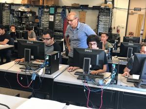 Moorpark College students in a classroom with computers. Moorpark College students in a classroom with computers.
