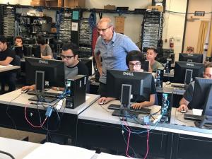 Moorpark College students in a classroom with computers.