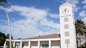 Side view of the clock tower on the Oxnard College campus.