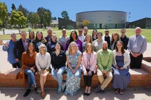 2025–26 Leadership Collaborative cohort standing together with District leaders outside on Oxnard College campus