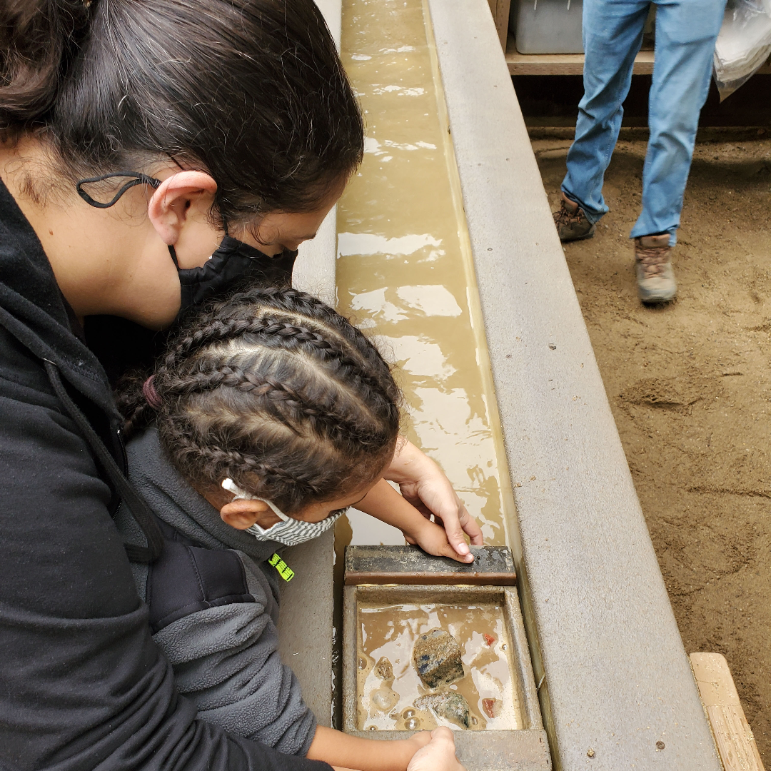 Shyan Diaz-Brown with her child participating in an outdoor activity