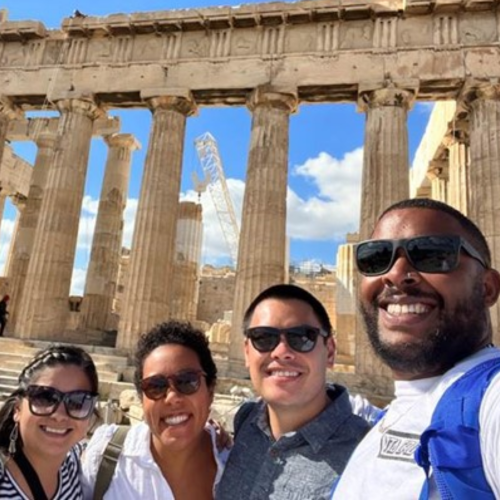 Tisa, her husband, and friends standing in front of the Parthenon